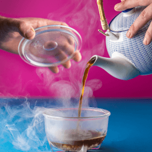 Hands pouring tea from teapot